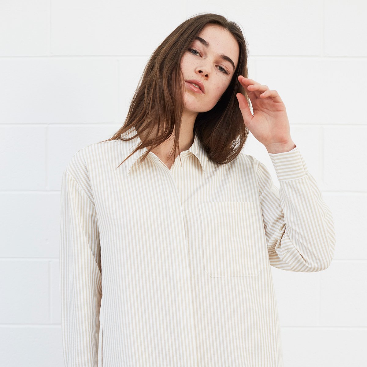 Woman wearing striped shirt dress 