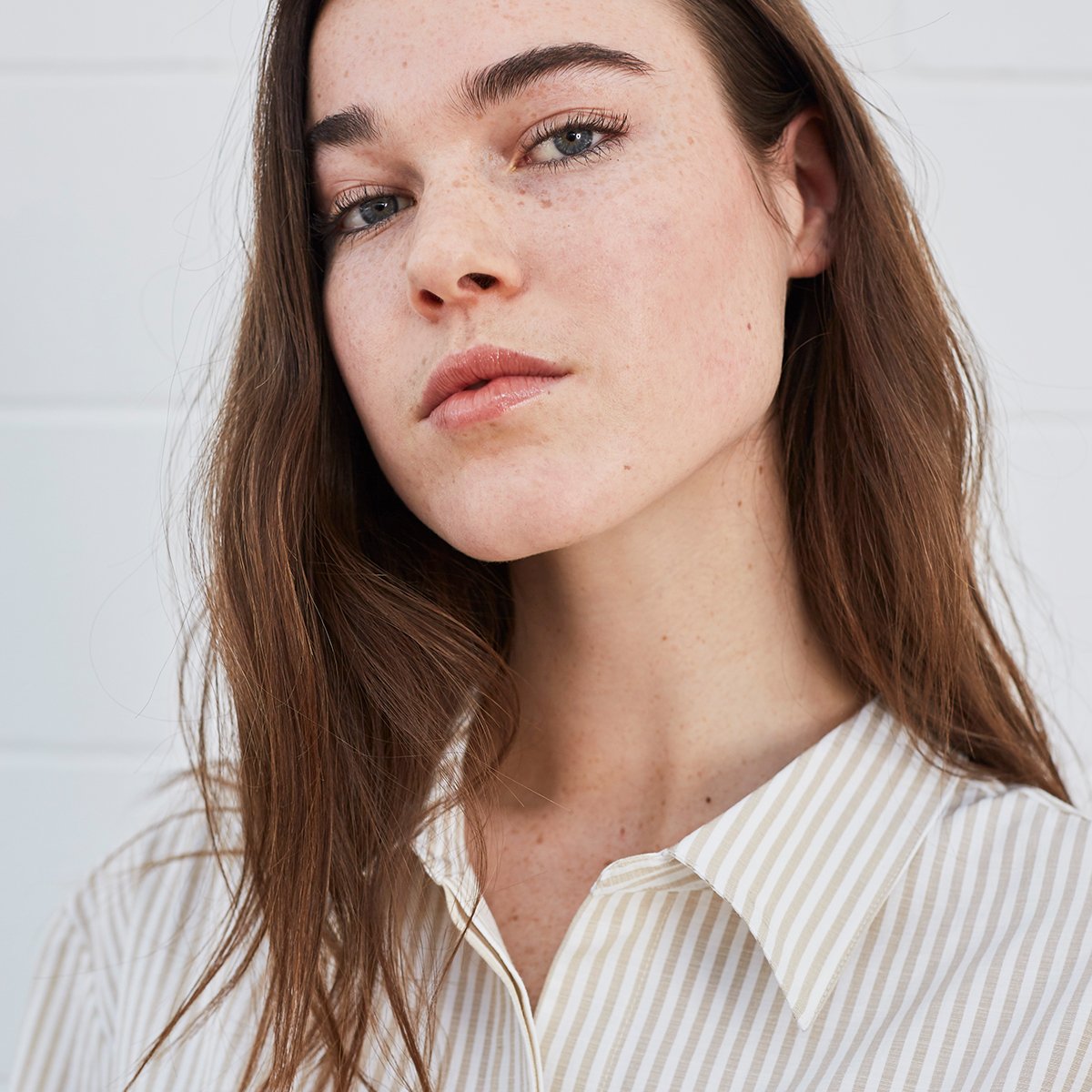 Woman wearing striped shirt dress 