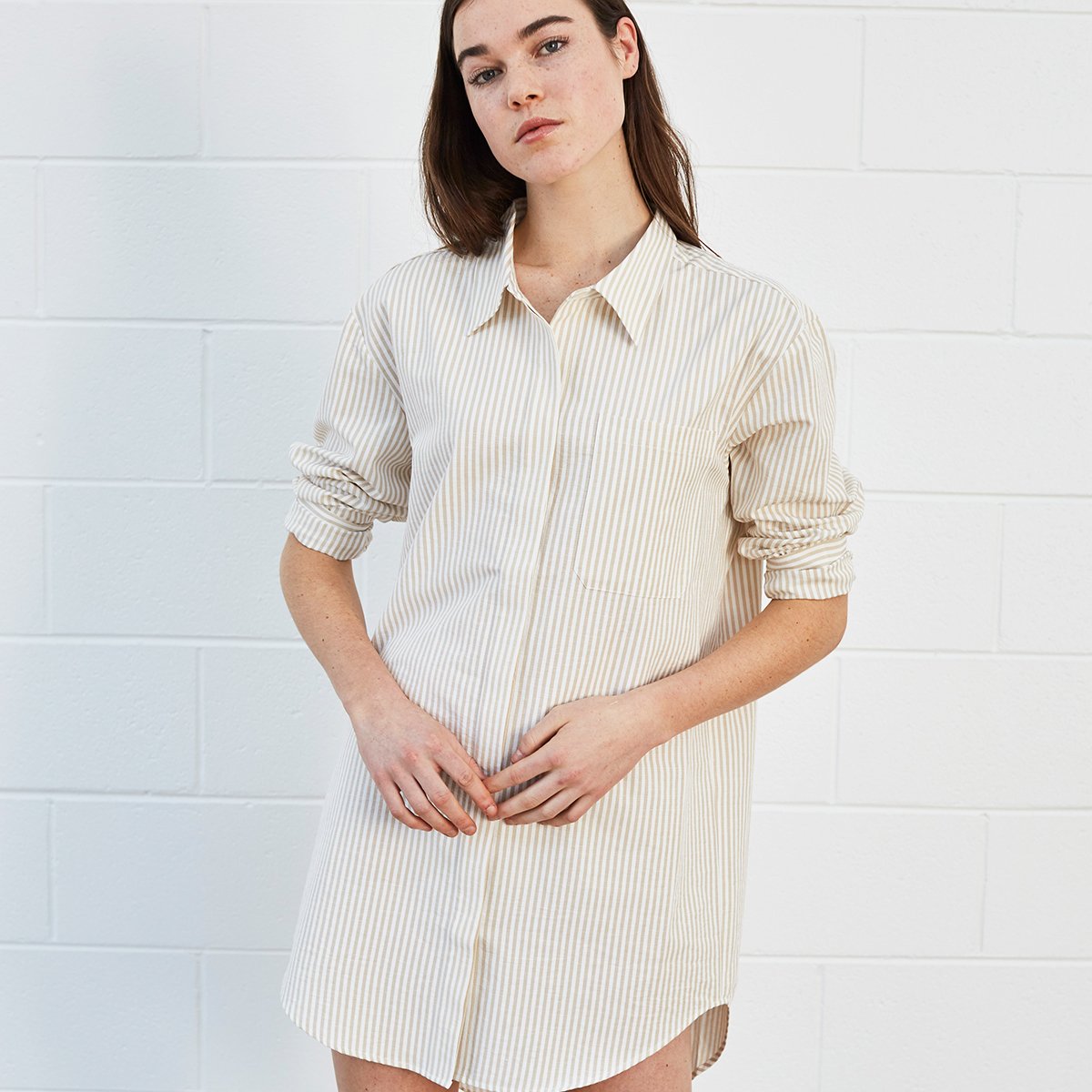 Woman wearing striped shirt dress 