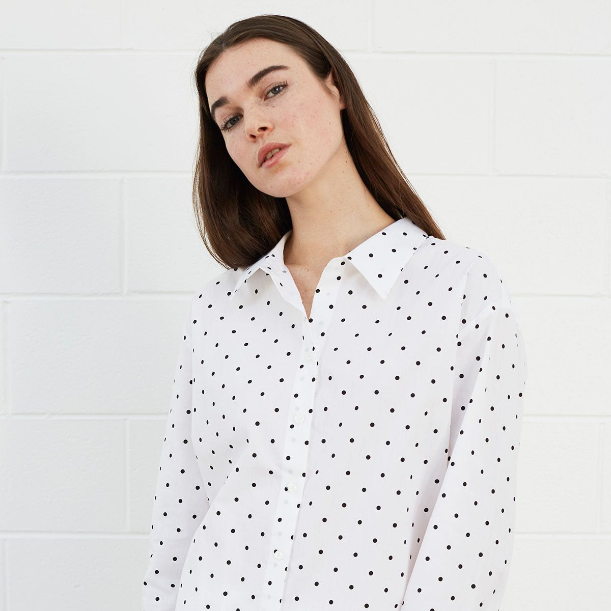 Woman wearing polka dot shirt