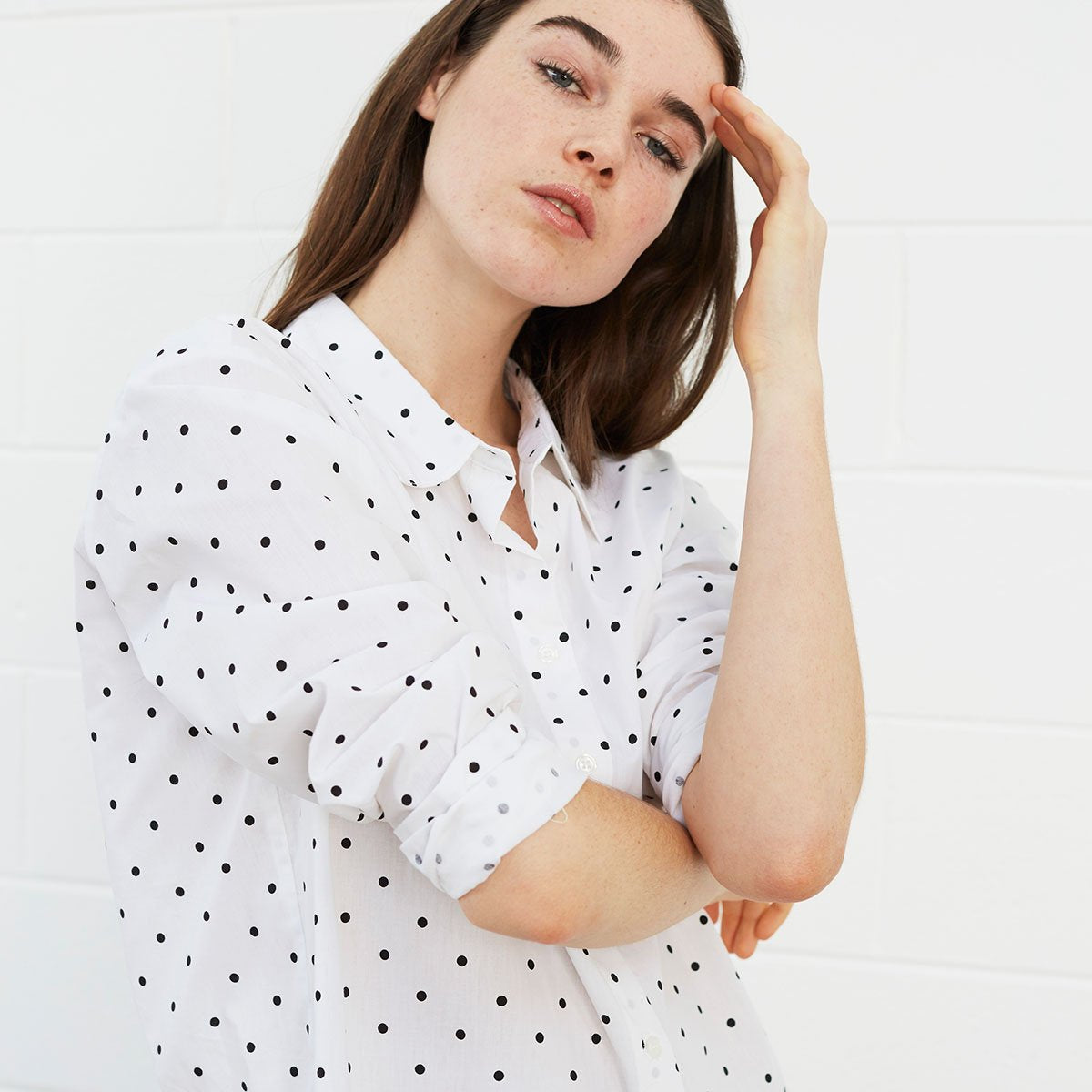 Woman wearing polka dot shirt