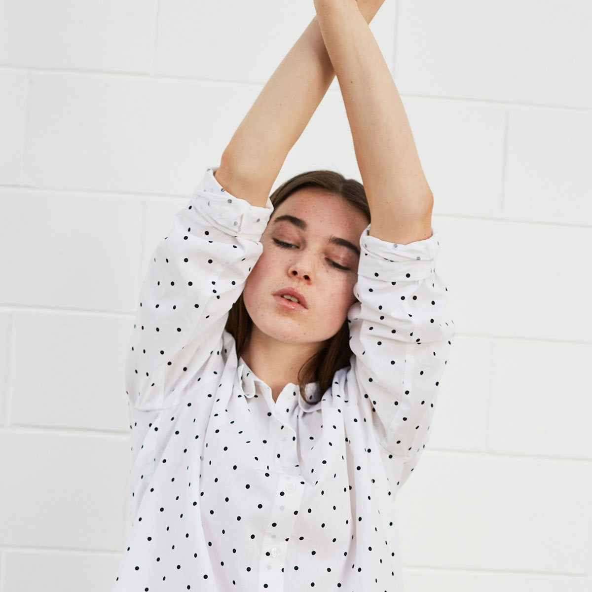 Woman wearing polka dot shirt