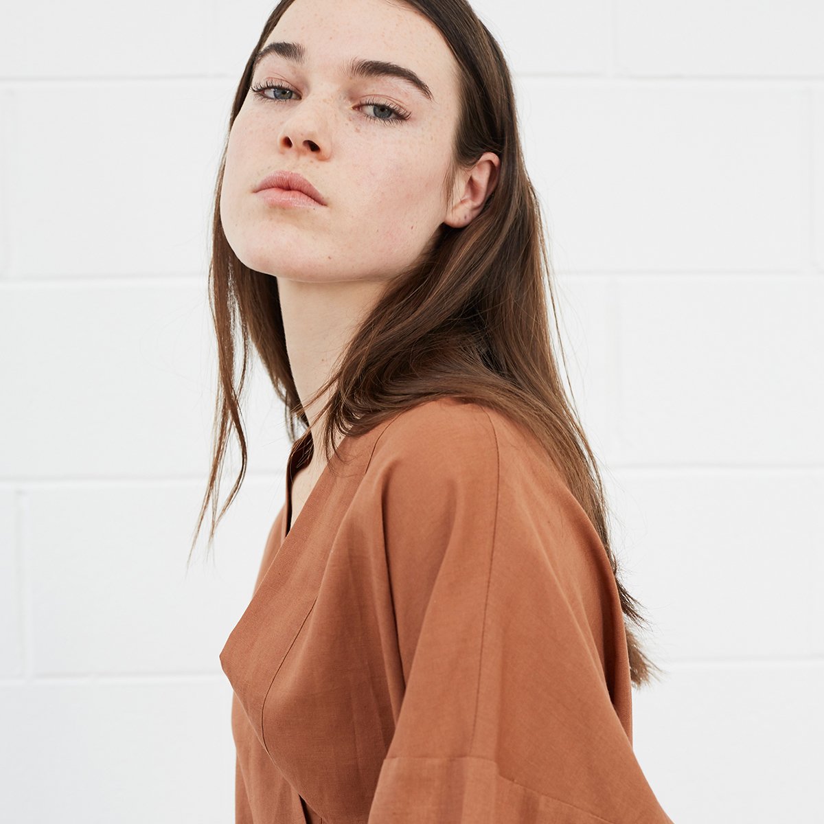 Woman wearing brown robe