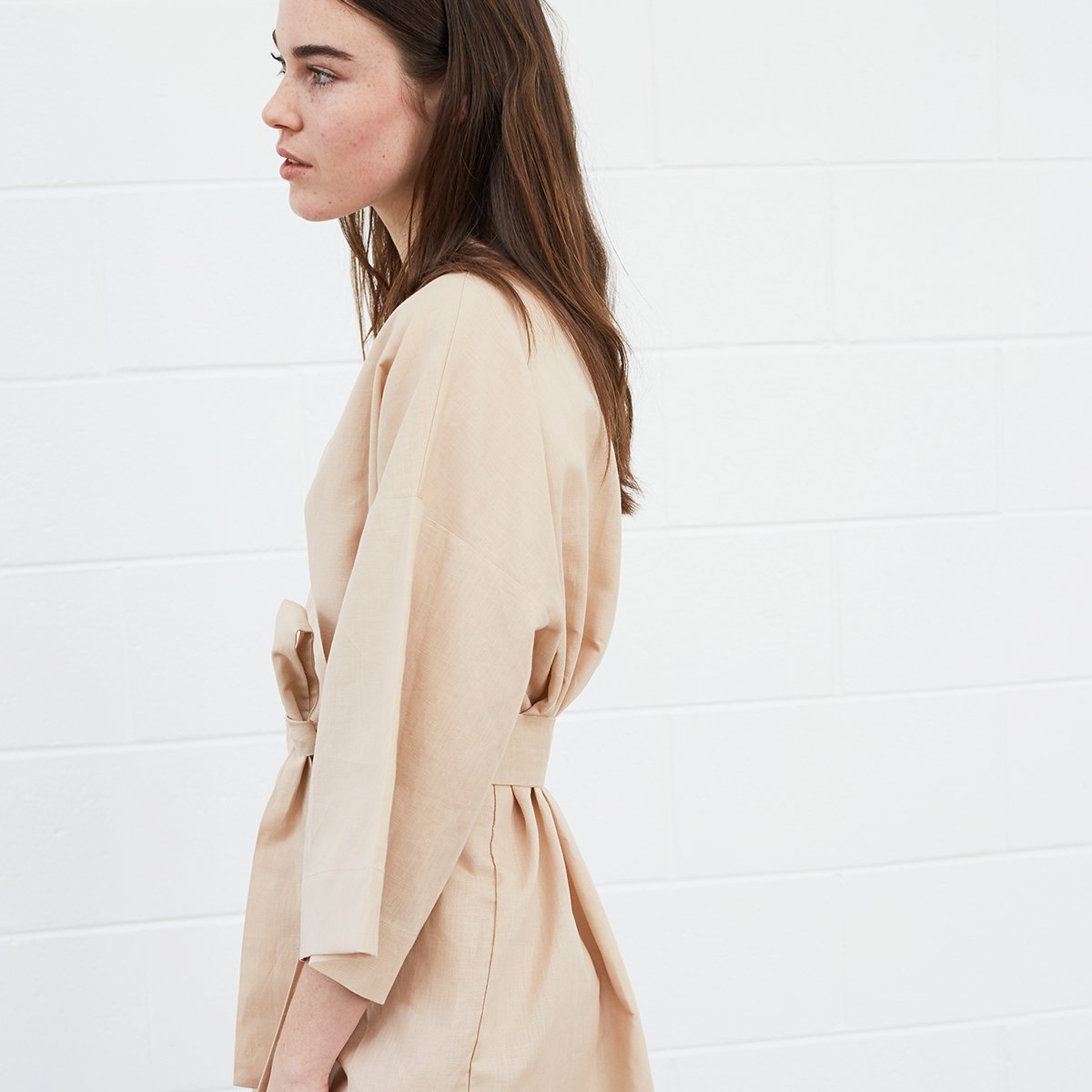 Woman wearing beige robe
