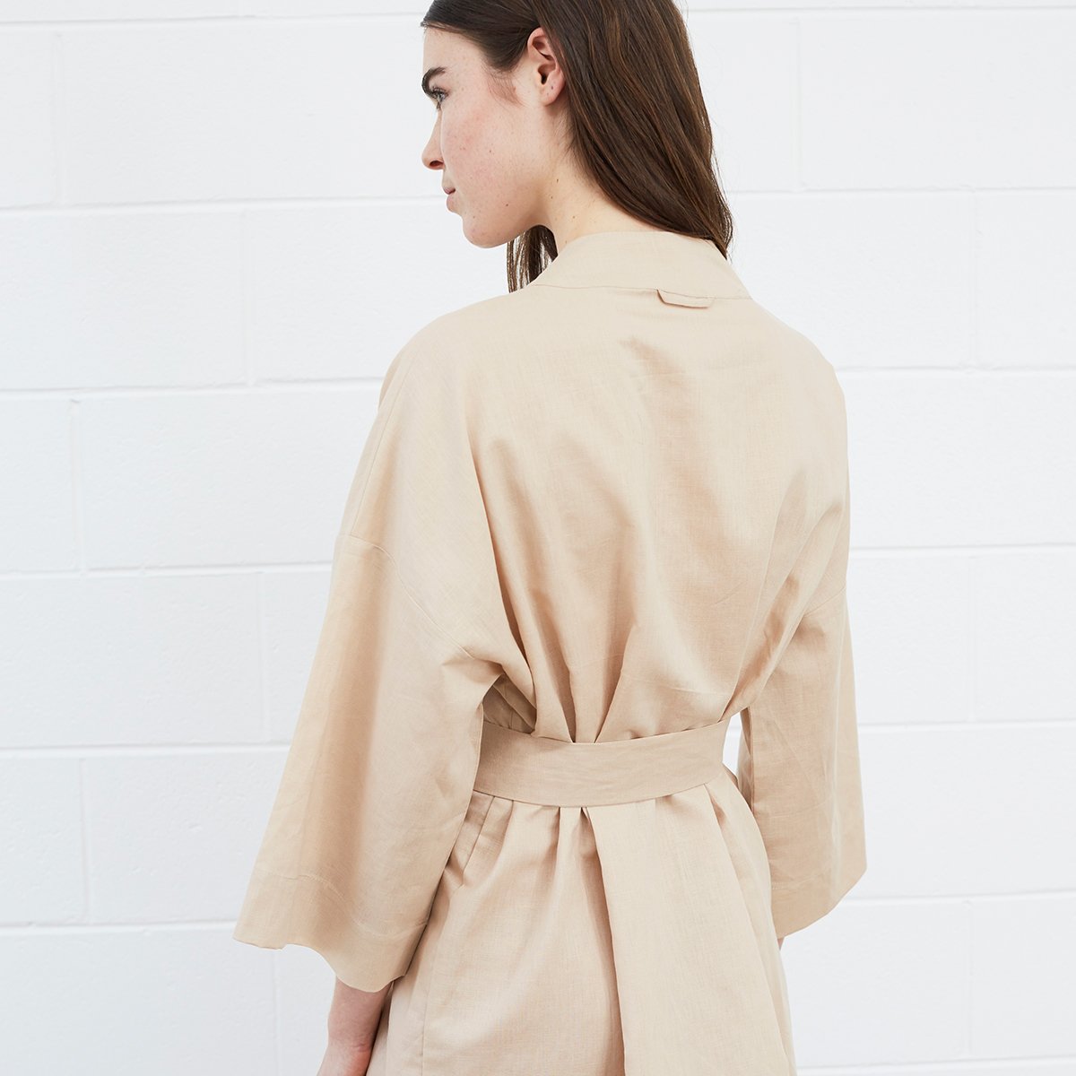Woman wearing beige robe