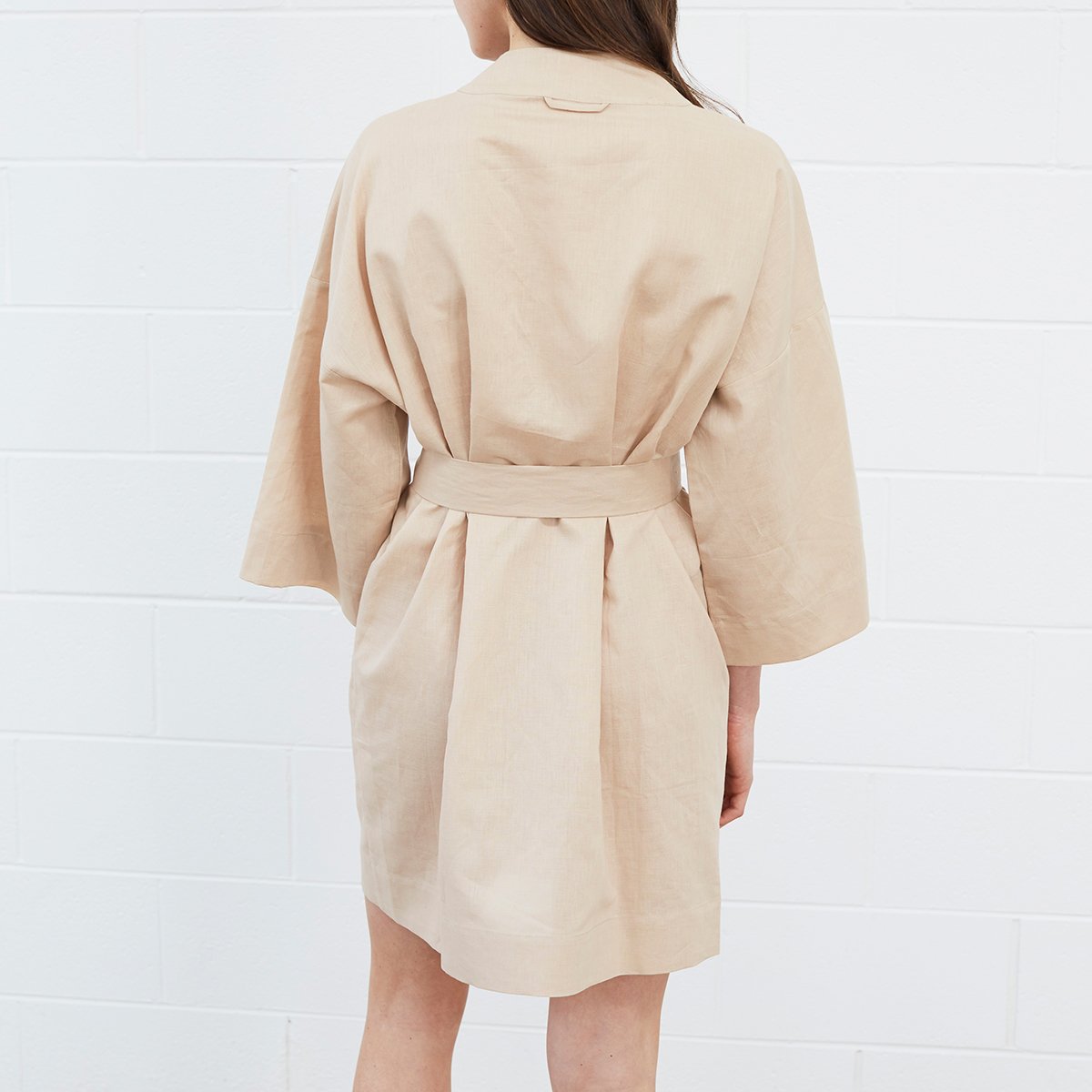 Woman wearing beige robe
