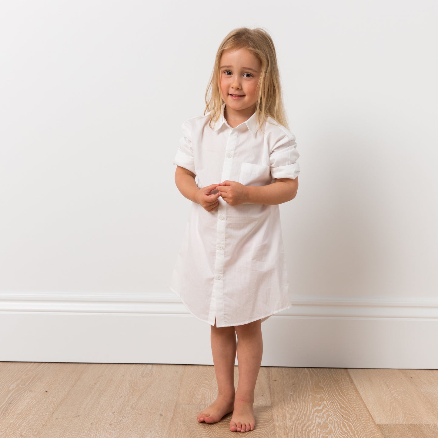 Girl wearing white shirt dress