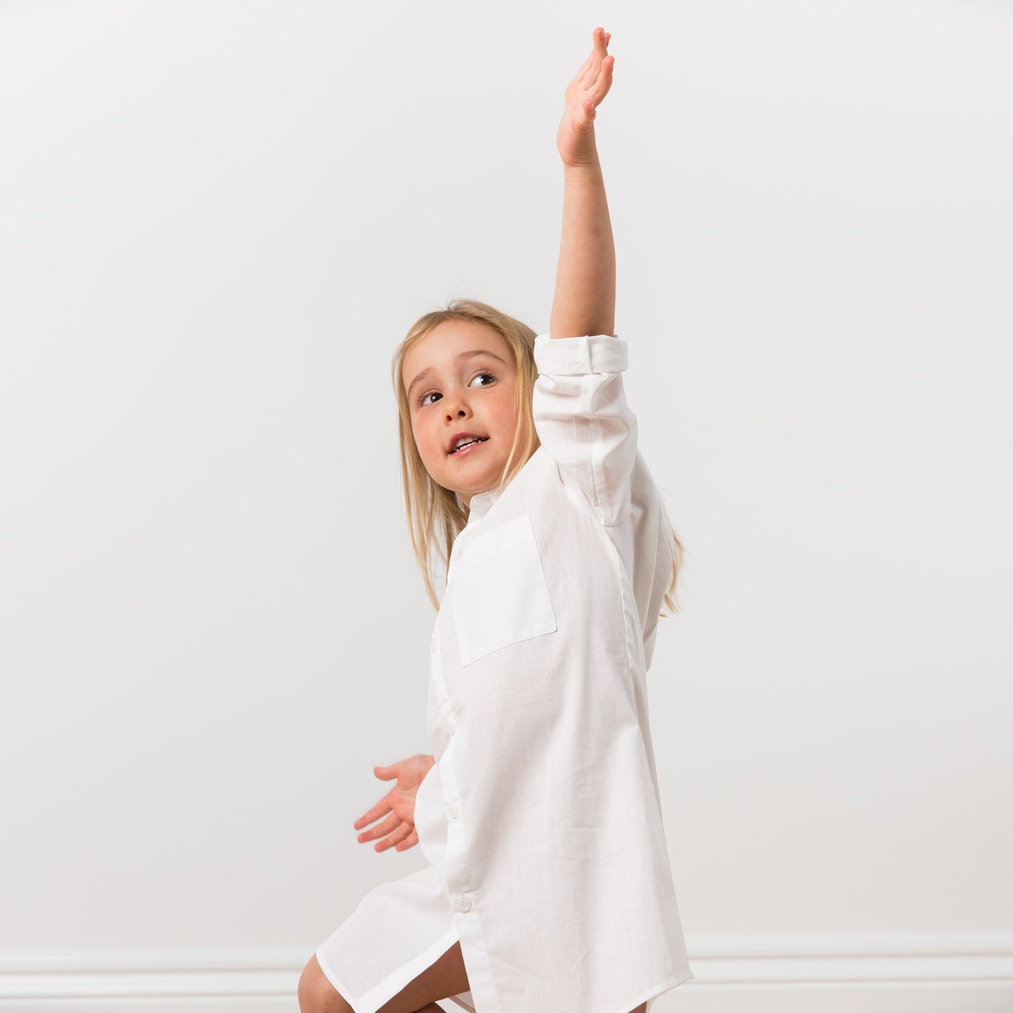 Girl wearing white shirt dress