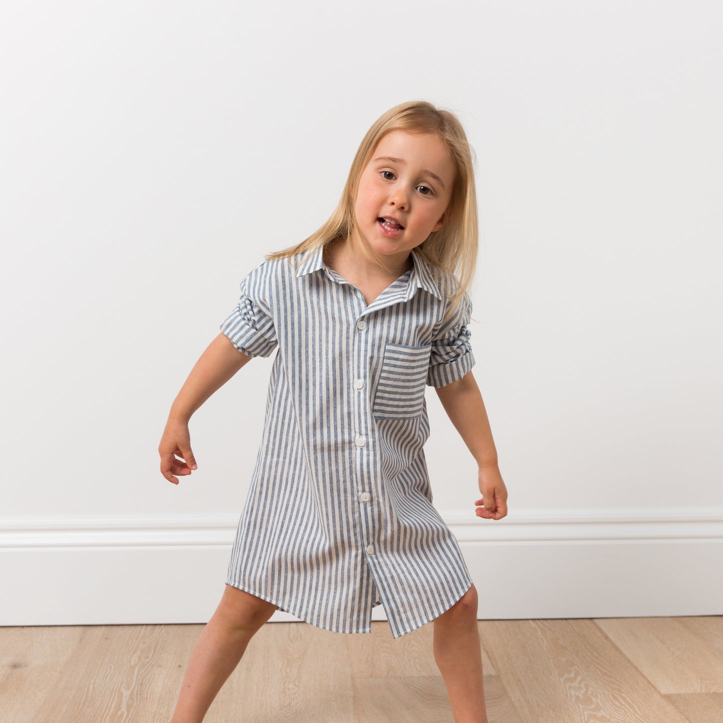 Girl wearing striped shirt dress