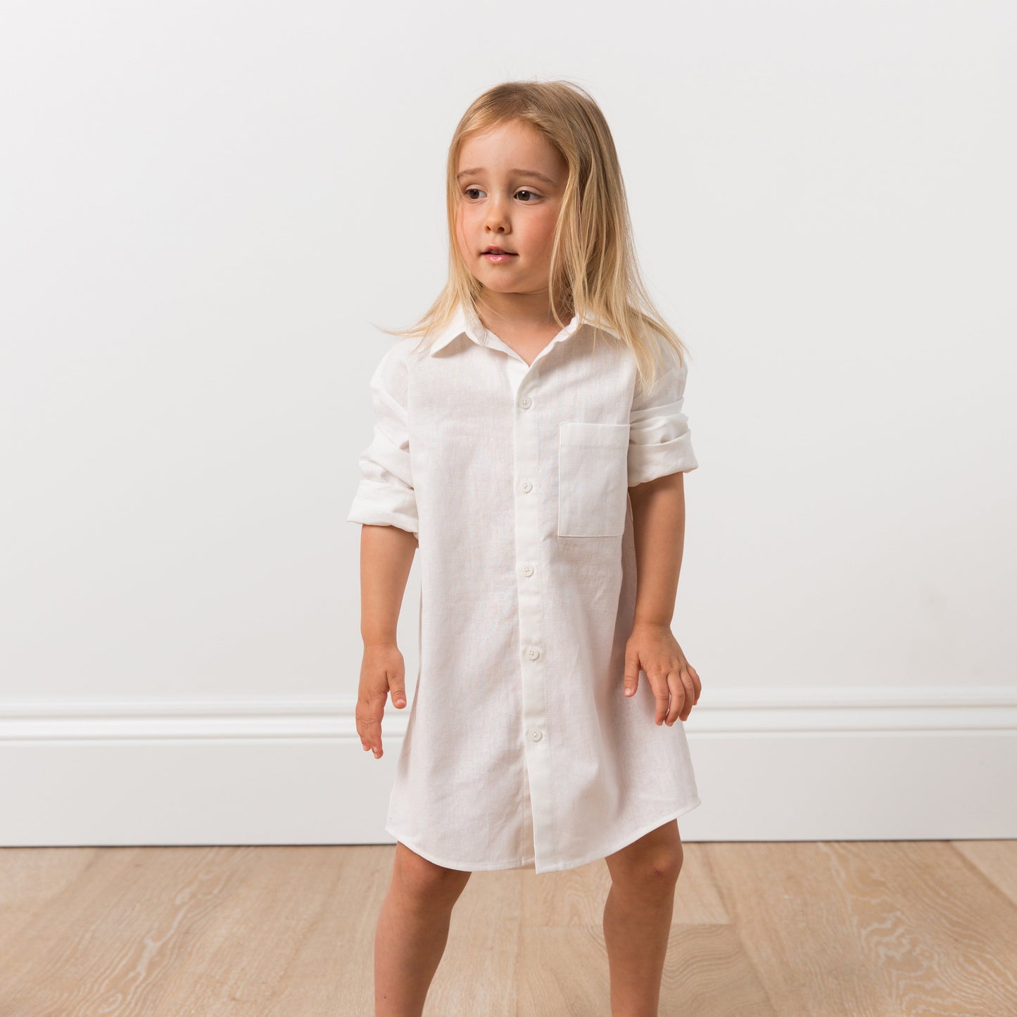 Girl wearing white shirt dress