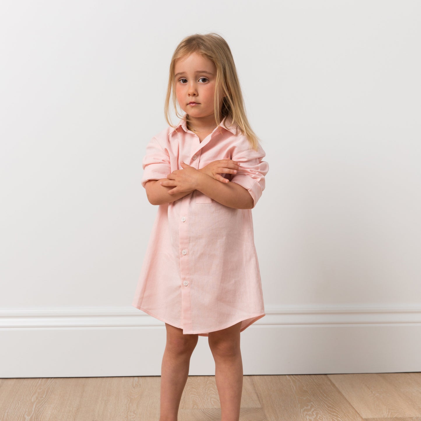 Girl wearing pink shirt dress