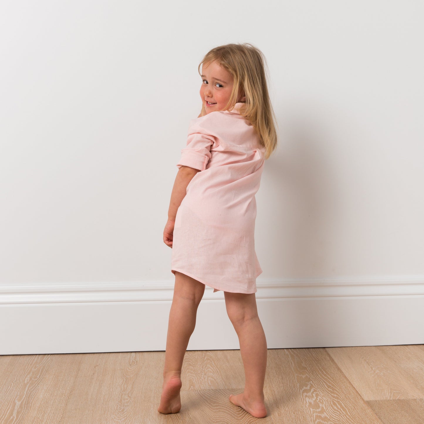 Girl wearing pink shirt dress