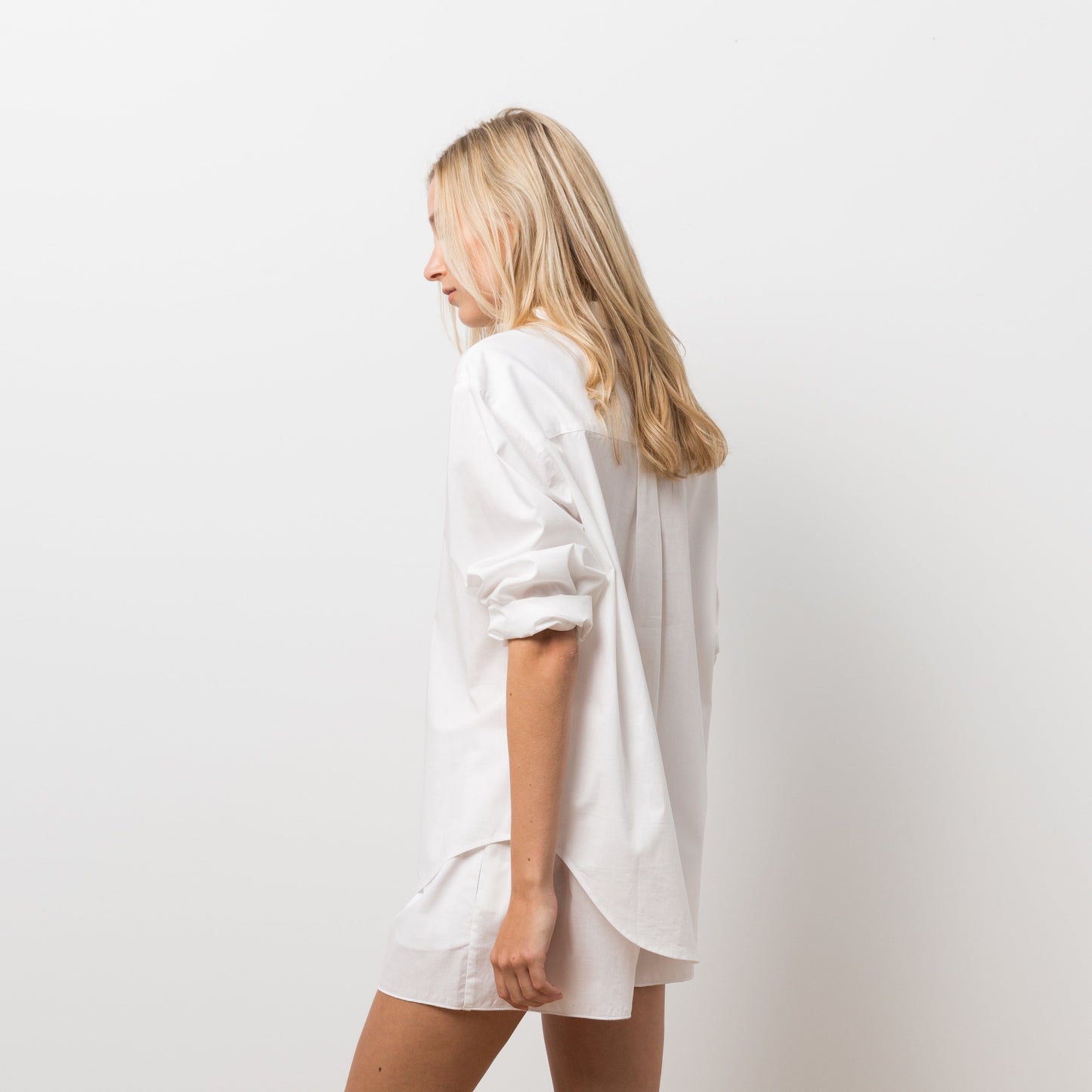 Woman wearing white shirt with shorts